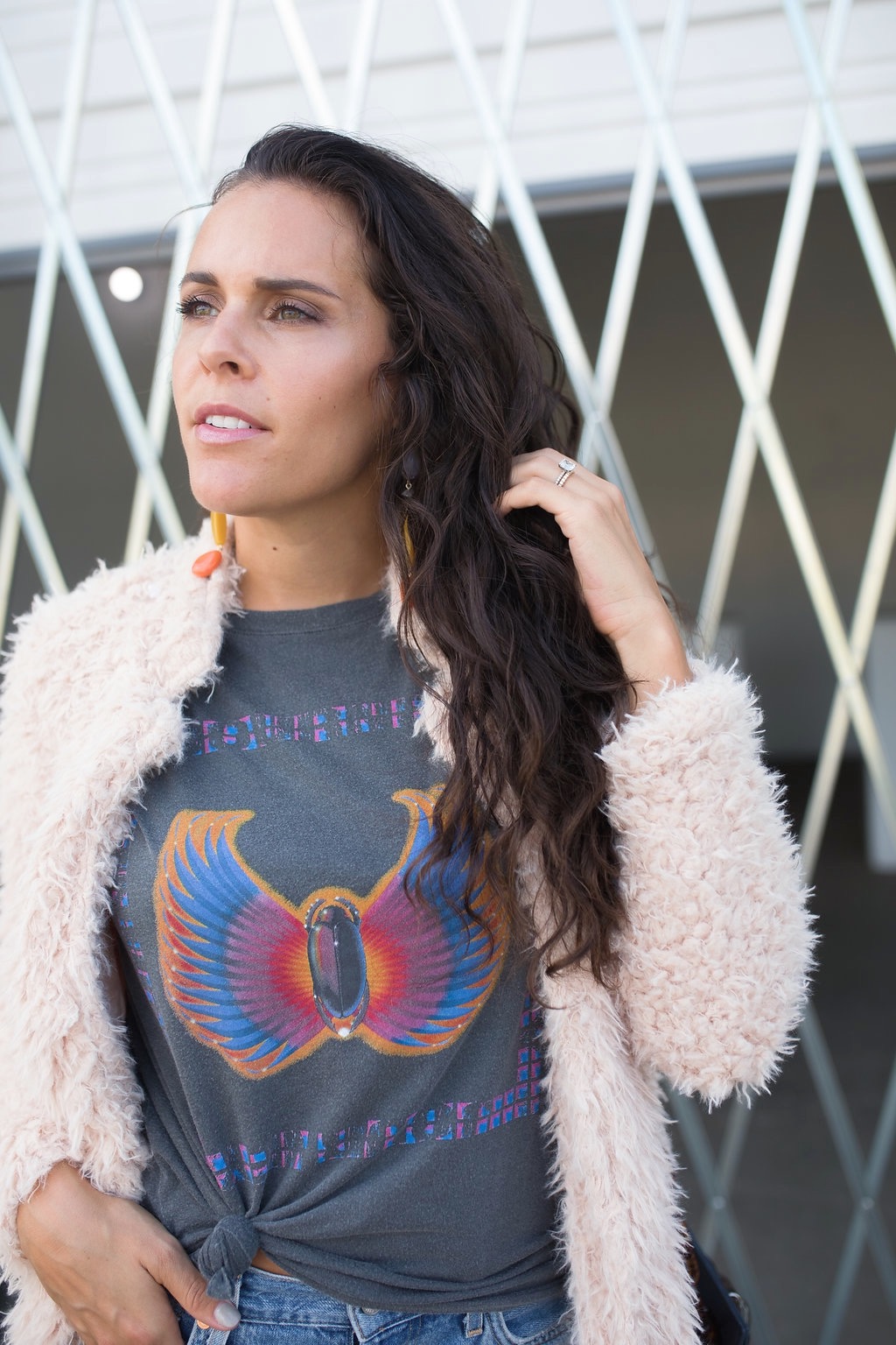 silver booties and a graphic tee