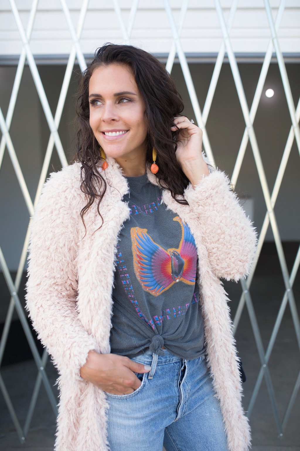 silver booties and a graphic tee